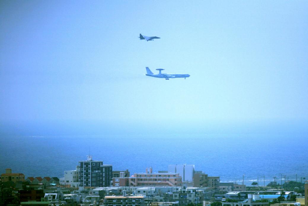 F-15 and AWAC plane approaching Kadena Air Base. 2008